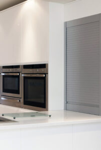 roller shutter in a modern high gloss bespoke kitchen