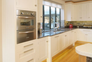 Hand-painted-kitchen-with-Wolf-appliance-fitted-into-tall-housing