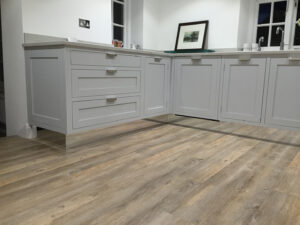 Mirrored plinths with painted kitchen furniture