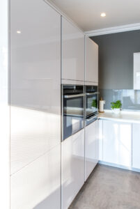 Handle-less kitchen with dekton worktops inspired by German efficiency